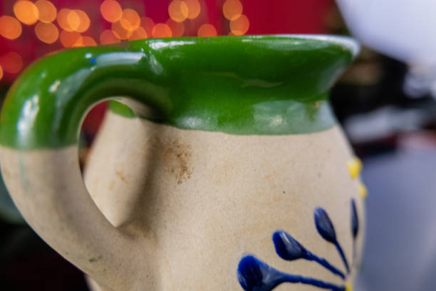 istock Mexican clay cup on a black table with blurry background 1292058539