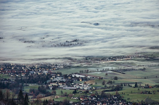 Morning mist view from Bachtel Tower, Zurich Oberland, to the Swiss Alps with a sea of fog over the lake of Zurich Switzerland