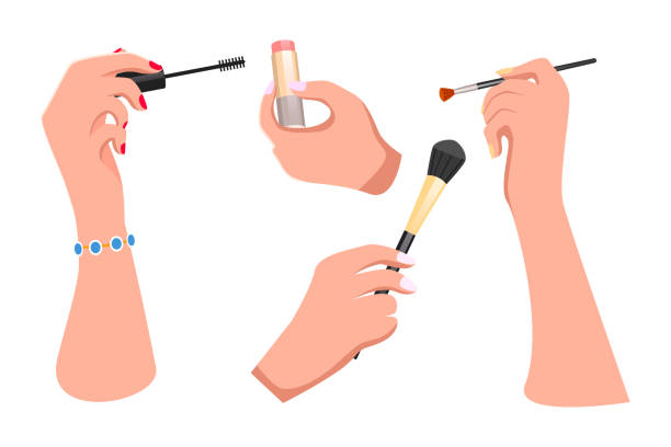 istock Girls hands with makeup accessories. Lipstick, eyeshadow brush, blush, mascara. Flat image 1292060808