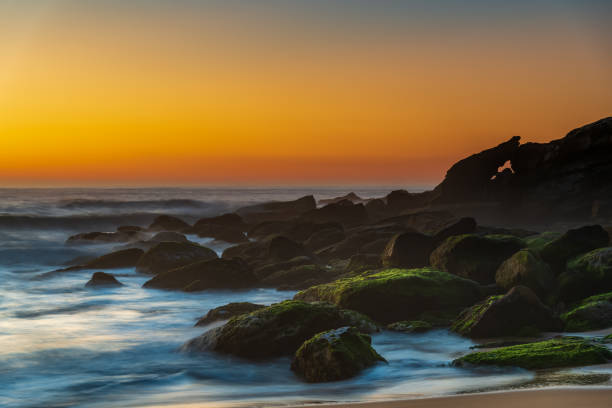 istock Sea Mist and Rocks Sunrise Seascape 1292061966
