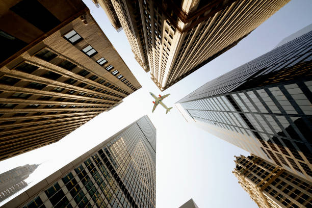 istock Airplane flying over skyscrapers, Lower Manhattan, NYC. 1292062028