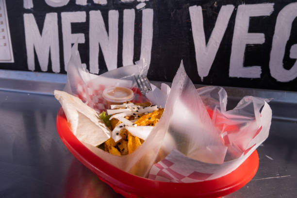 istock Fries and onions on a plastic basket with words behind it 1292066535