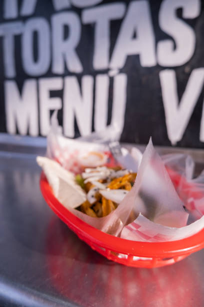 istock Fries and onions on a plastic basket with words as background 1292067472