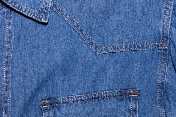 close up shot of blue denim jeans shirt. clothing store and shopping concepts - denim jacket imagens e fotografias de stock