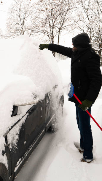 istock Snow covered the man's car. 1292068618