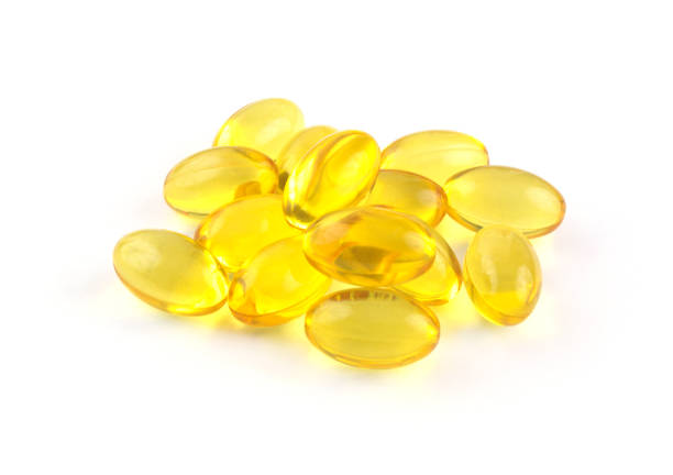 istock Heap of omega 3 capsules isolated 1292077580