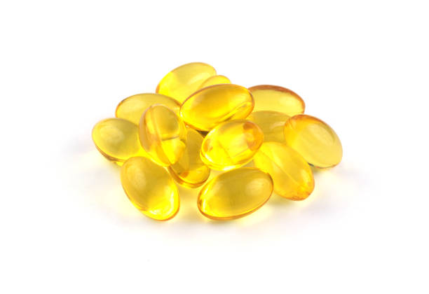 istock Heap of omega 3 capsules isolated 1292077583