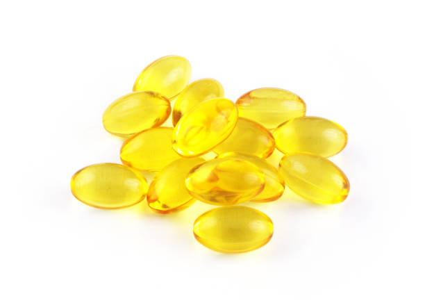 istock Heap of omega 3 capsules isolated 1292077719