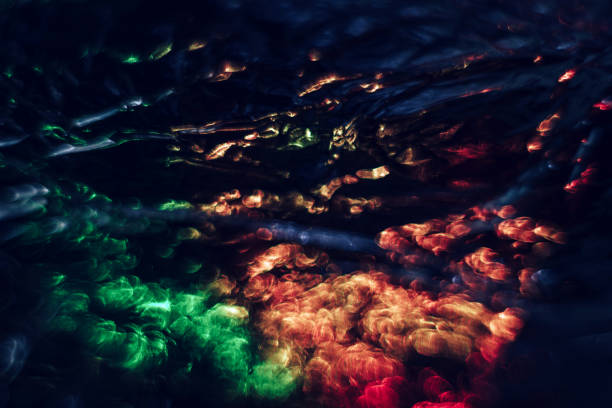 istock Beautiful multi colored abstract optical light bokeh on a dark background. 1292078911