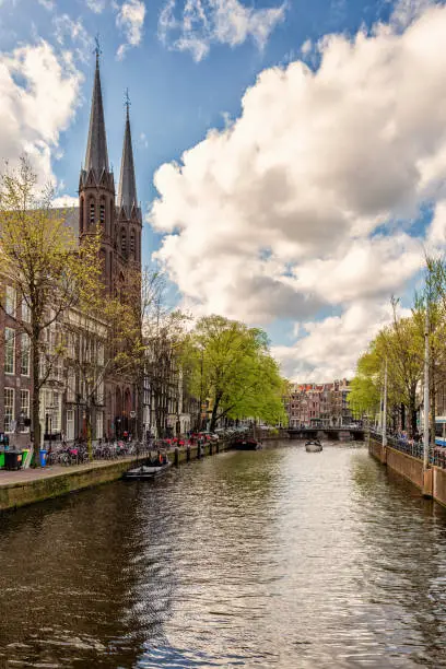 Photo of Amsterdam Netherlands dancing houses over river Amstel landmark