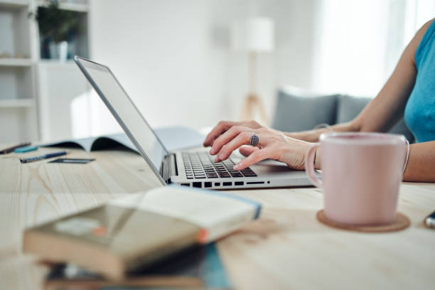 istock Woman working from home, using laptop / notebook, modern freelance concept. 1292081172