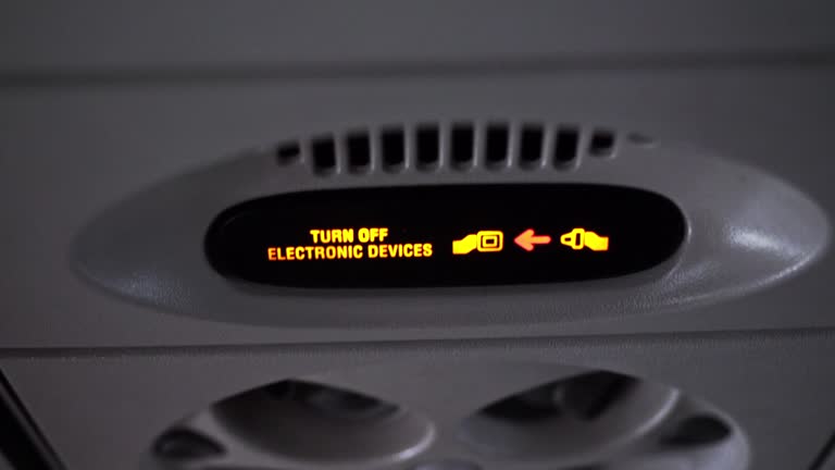 Turbulence shot of fasten seat belt sign warning on an airplane