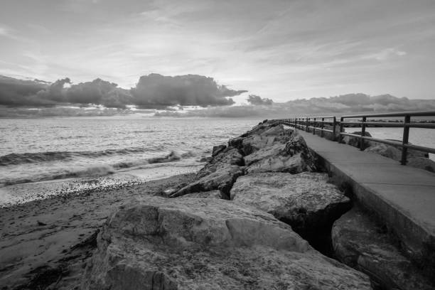 istock Moody Black And White Rocky Coastal Background 1292082981