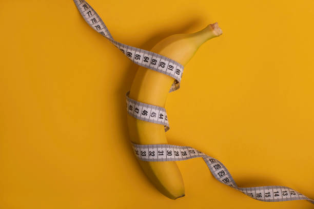istock banana is on diet, measuring tape 1292083871