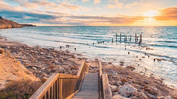 Port Willunga Beach view with jetty ruins at sunset Port Willunga Beach view with jetty ruins at sunset,  South Australia south australia photos stock pictures, royalty-free photos & images