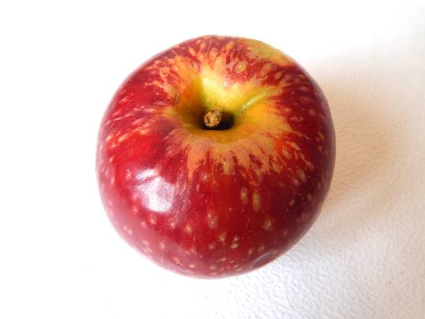 istock The ripe apple isolated on a white background. A large red apple close-up. 1292088107