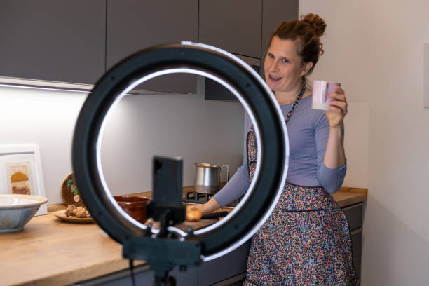 istock Cooking and live streaming video on smartphone with LED ring light 1292089022