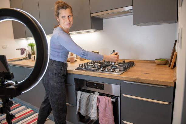 istock Cooking and live streaming video on smartphone with LED ring light 1292089281