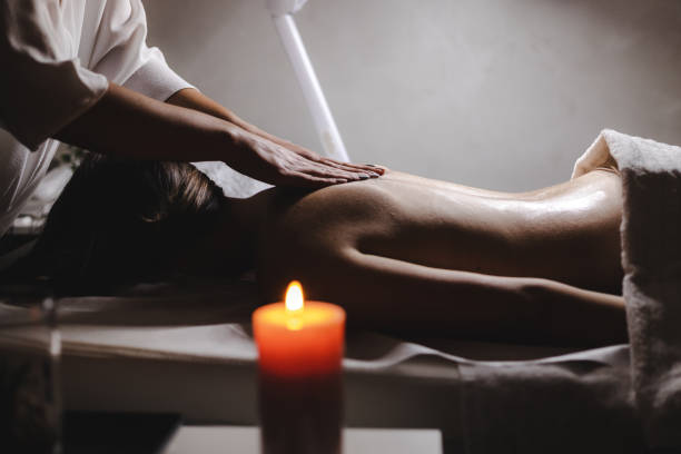 istock Young woman relaxing during back massage at the spa 1292090383