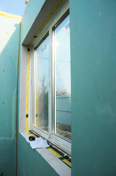 istock PVC window installation in a frame panel house with mineral glass insulation. 1292091041