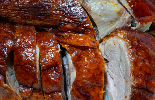 Top view of sliced roast duck or Peking duck. Close-up and macro.