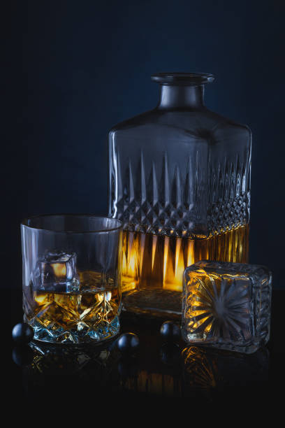 istock Still life photo, whiskey bottle with glass 1292093378