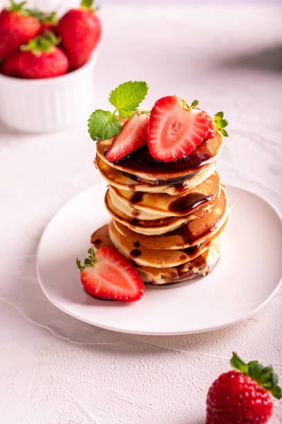 istock Sweet crepes with strawberry on a plate 1292095121