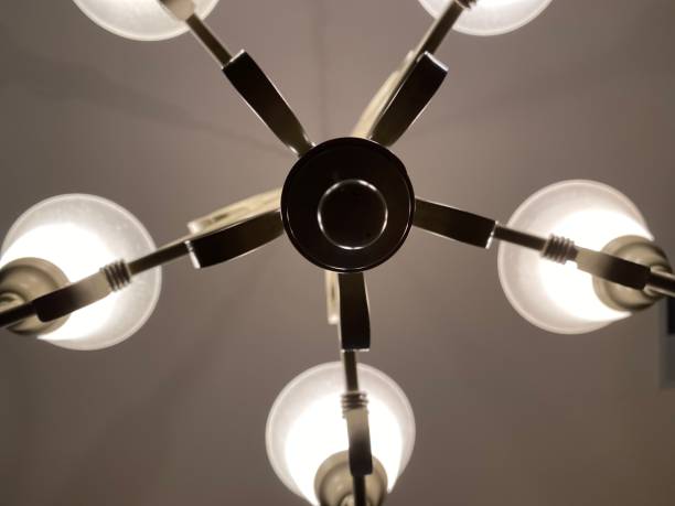 istock Chandelier-a branched often ornate lighting fixture suspended from a ceiling. 1292097685