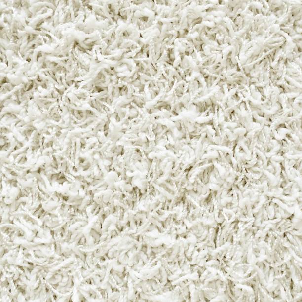 istock White shaggy carpet texture, close up 1292100068