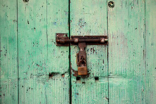 Blue door with chain and padlock