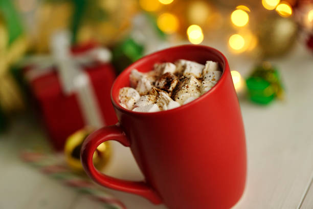 istock Cup off coffee, marshmallows and christmas lights 1292102660