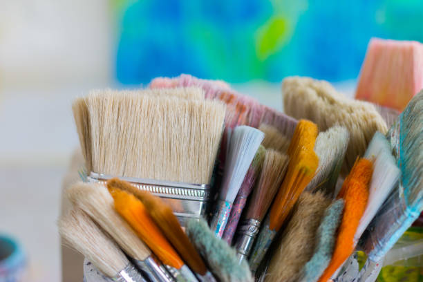 istock Painting artwork: paint brushes on painting background 1292103966
