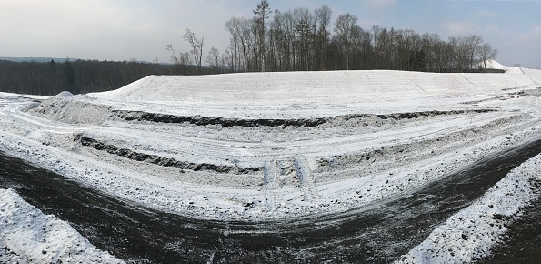 Panoramic view of a Construction site in winter for a new highway  in the country.