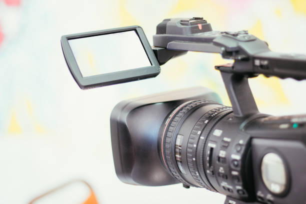 istock Professional film camera on a tripod, live mobile production indoor 1292104158