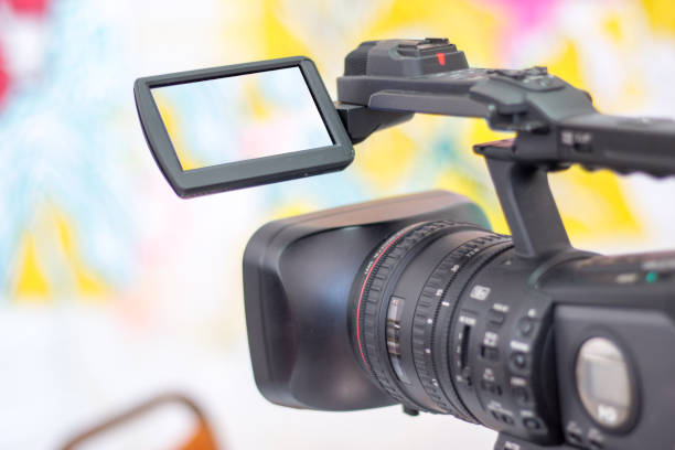 istock Professional film camera on a tripod, live mobile production indoor 1292104168