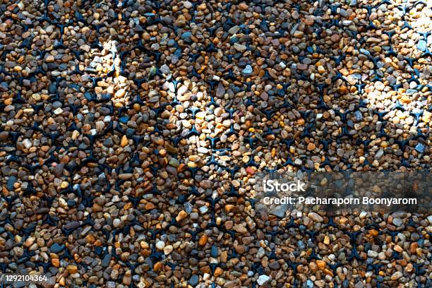 The Tiny Small Rocks All Over The Pave Walk Road On The Backyard With  Natural Sunlight And Shadow Stock Photo - Download Image Now - iStock