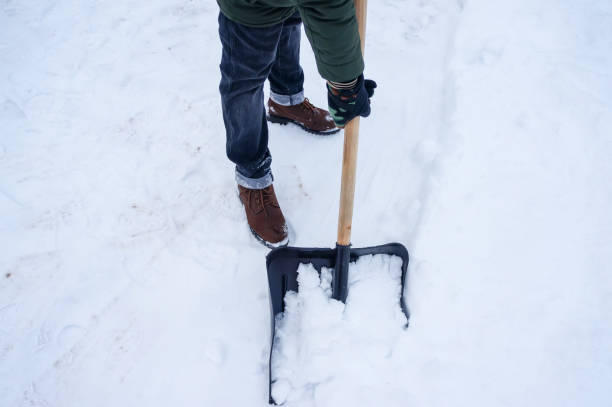 istock a man removes snow with a shovel 1292105309