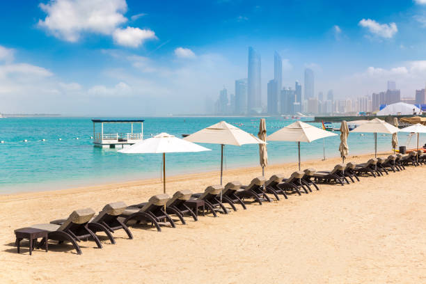 istock Sunbeds at the beach in Abu Dhabi 1292108383