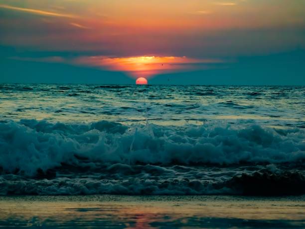 istock Amazing Sunset view over sea waves 1292110670
