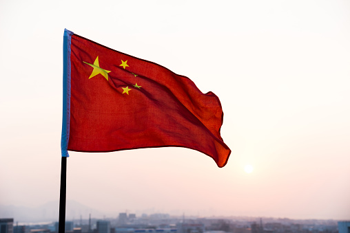China flag waving in sunset