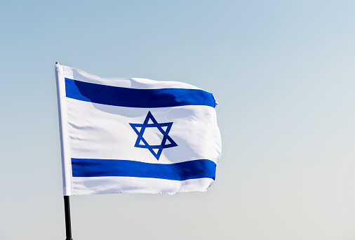Israeli flag in the sunset