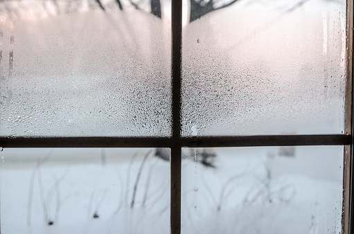 Condensation and frost on a window during a really cold winter day