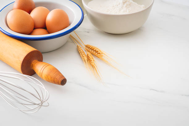 istock Baking homemade bread on white kitchen worktop with ingredients for cooking 1292115316