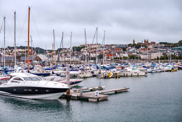 Crowded Marina and surrounding town at Saint Peter Port on the Isle of Guernsey Crowded Marina and surrounding town at Saint Peter Port on the Isle of Guernsey guernsey city stock pictures, royalty-free photos & images