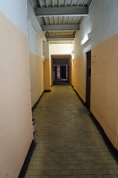 istock A deserted corridor to an old factory 1292117051