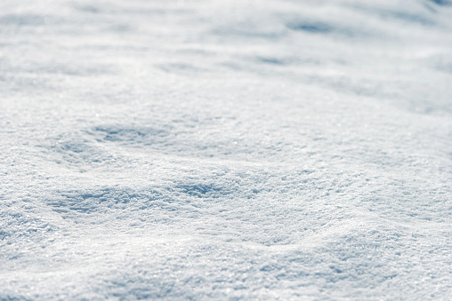 natural winter background, fresh fluffy snow, sun glare, bokeh