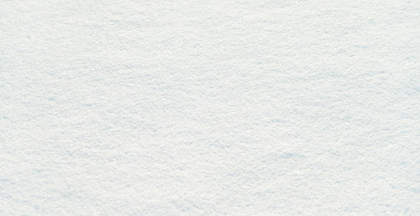 istock Close up of white snow background 1292123304
