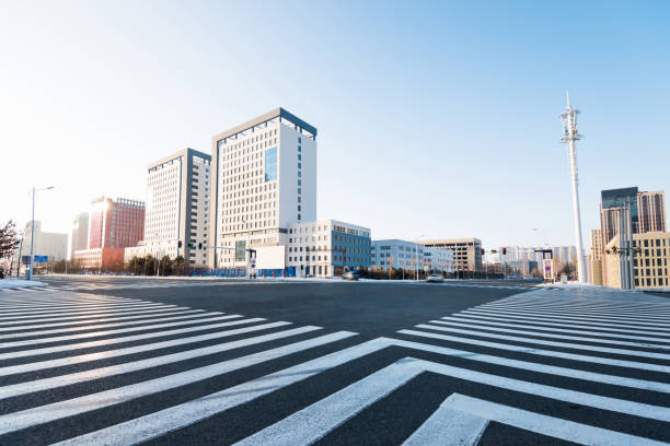 Zebra crossing and modern buildings in winter Zebra crossing and modern buildings in winter. zebra crossing photos stock pictures, royalty-free photos & images