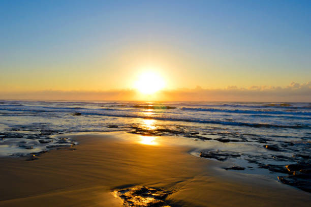 istock Beach landscape at sunset. Water, rocks, sand. 1292125463