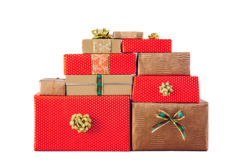 Lot of red dotted and golden color wrapped presents isolated on white background.